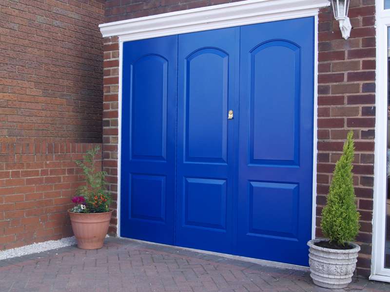 White Garage Doors with car parked in front