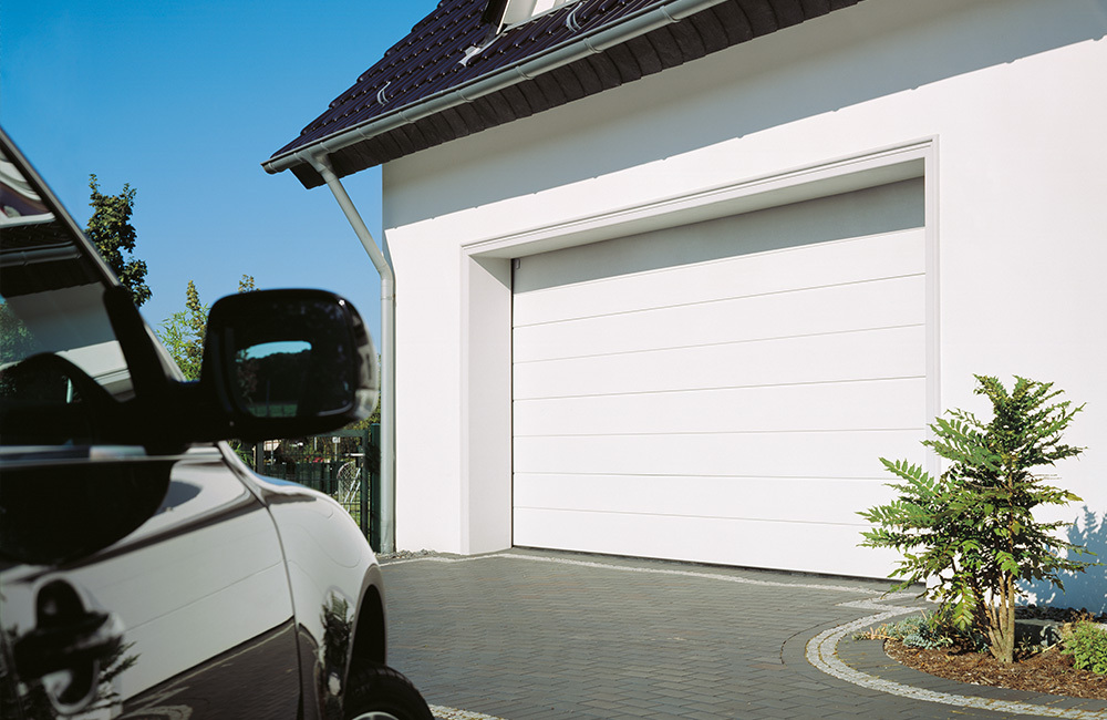 White Garage Doors with car parked in front